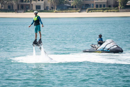Dubai January 2020. Water extreme sport. The guy is flying at the aquatic flyboard. Extreme rest on...
