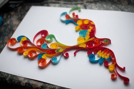 Paper Firebird made in quilling craft technic.の写真素材