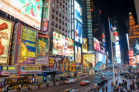 NEW YORK CITY - MARCH 12, 2018: Times Square is a busy tourist intersection of neon art and commerce and is an iconic street of Manhattanのeditorial素材