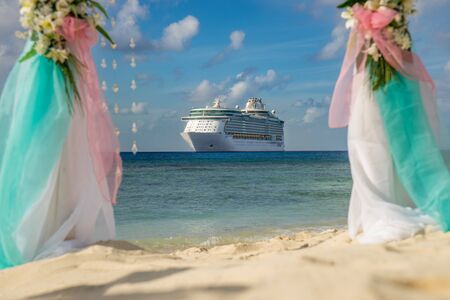 Scenery for a wedding on the beach with a cruise liner in the background.の写真素材