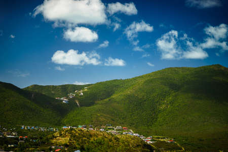 View of the village near the green hill from the airの写真素材