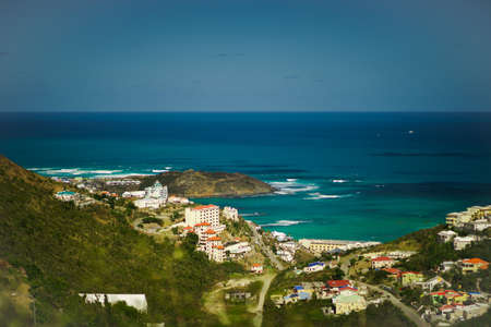 View of the village near the green and sea hill from the airの写真素材