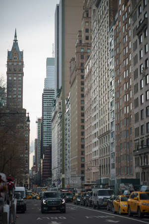New York, NY, USA-MARCH 03, 2018: 59th Street near central park with cars and public transport
