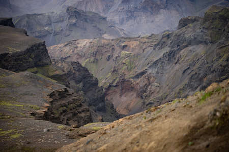 Canyon with different colored layers cliffs and hillsの写真素材