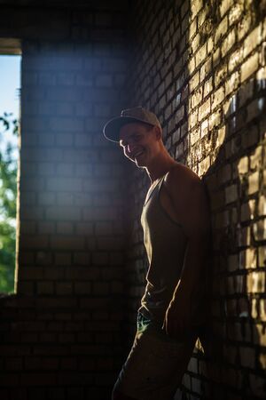 Muscular, happy Young Man Inside Abandoned Building.の写真素材