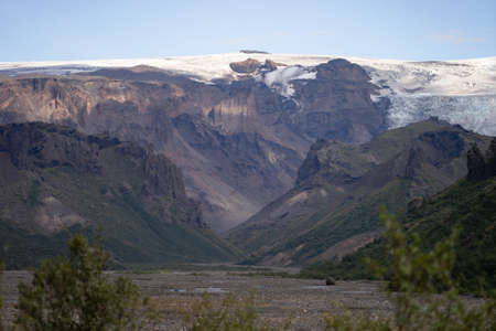 Scenic view Of Mountain Among Snowy Mountains nearby river in Thorsmork, Icelandの写真素材