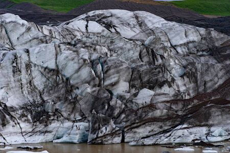Glacier details with ash in the ice - Iceland.