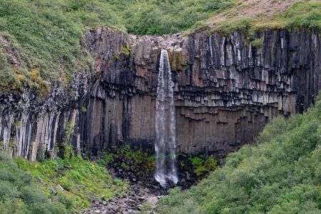 Iceland waterfall closeup view of the gods cliff with long exposure smooth motion of water in summer landscapeの写真素材