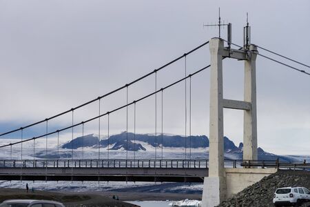 Beautiful cold landscape of Jokulsarlon glacier lagoon, Iceland, during the summer with the bridge as a backgroundの写真素材
