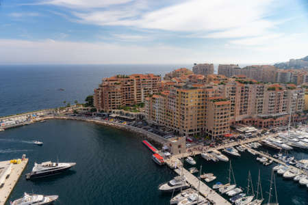 Port de Fontvieille, Monte Carlo, Monaco, Jul 2019. Precious apartments and harbor with luxury yachts in the bay, Monte Carlo, Monaco, Europeのeditorial素材