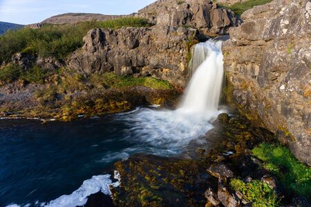 Iceland waterfall closeup view of the gods cliff with long exposure smooth motion of water in summer landscapeの写真素材