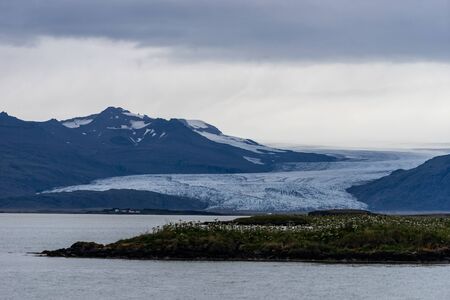 Glaciers on the mountain with lake foreground, Iceland.