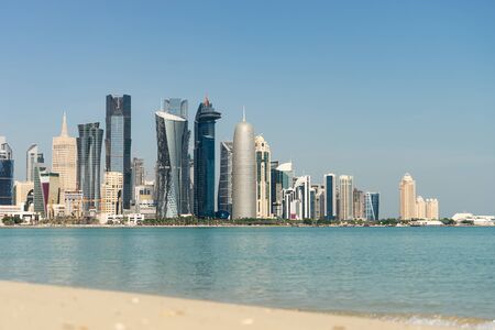 View of city center with skyscrapers from the other side of sea in Doha, Qatar.の写真素材