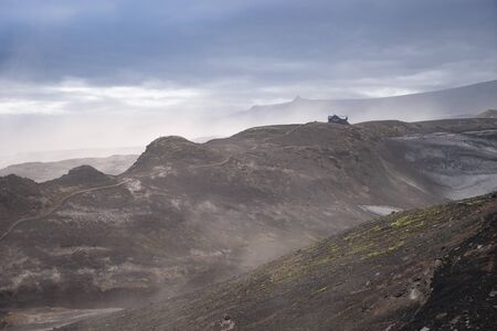 Icelandic Hut on the volcanic landscape during strong ash storm on the Fimmvorduhals hiking trail. Icelandの写真素材