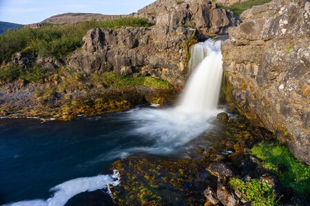 Iceland waterfall closeup view of the gods cliff with long exposure smooth motion of water in summer landscape.の写真素材