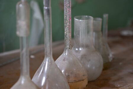 Vintage equipment of chemical laboratory on wooden table