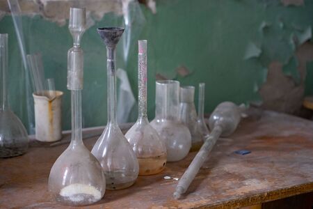 Vintage equipment of chemical laboratory on wooden tableの写真素材