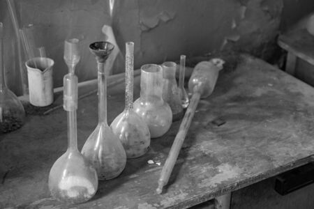 Vintage equipment of chemical laboratory on wooden tableの写真素材