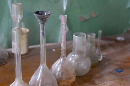 Vintage equipment of chemical laboratory on wooden tableの写真素材