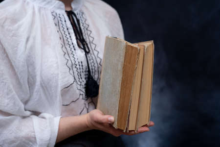 Closeup of Hands Holding A Stack Of Books. Concept of self-education, self-developmentの写真素材