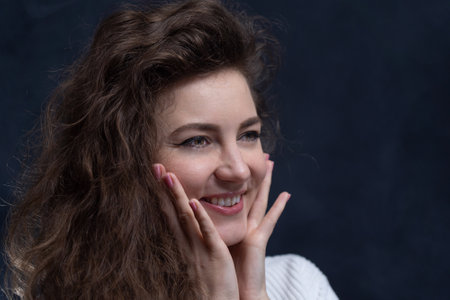 Happy, curly, smiling, Self-Assured Woman On Isolated Background.の写真素材