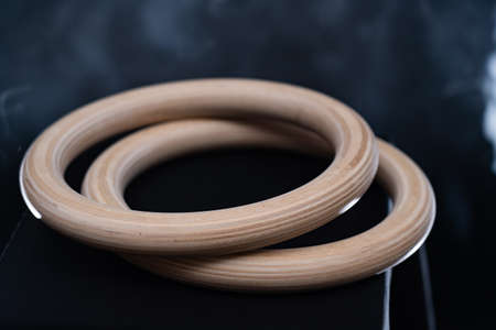 Gymnastic Rings isolated on black backgroundの写真素材