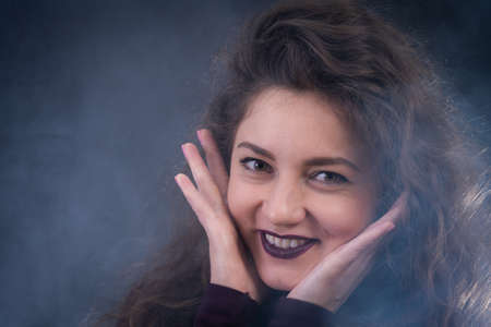 Happy, curly, smiling, Self-Assured Woman On Isolated Background.の写真素材