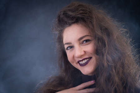 Happy, curly, smiling, Self-Assured Woman On Isolated Background.の写真素材
