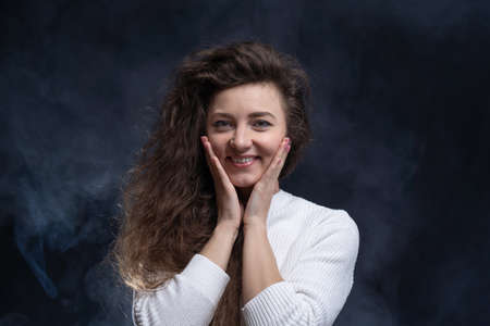 Happy, curly, smiling, Self-Assured Woman On Isolated Background.の写真素材