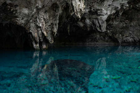 Lake in the cabe of blue clear and calm water with reflection. Travel and adventure conceptの写真素材