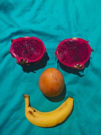 Happy and smiling face made by tropical fruitsの写真素材