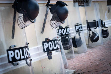 Police equipment such as shield and helmet on the street. Protection and force conceptの写真素材