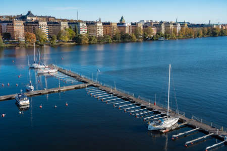 Top view of many floating piers with sailboat on water in Stockholm, Swedenの写真素材