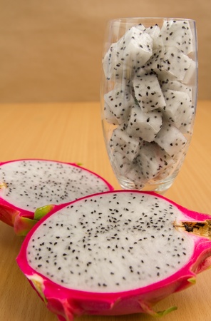 dragon fruit in glass with brown background, diet fruitの写真素材
