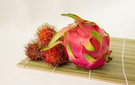 dragon fruit and rambutan with white backgroundの写真素材