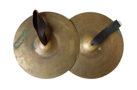 Old cymbals with leather handheld on white background, include pathの写真素材