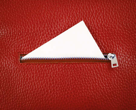 Unzip leather wallet with white empty paper card.