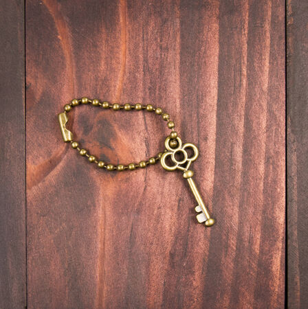 Close up Vintage key on wooden background.の写真素材