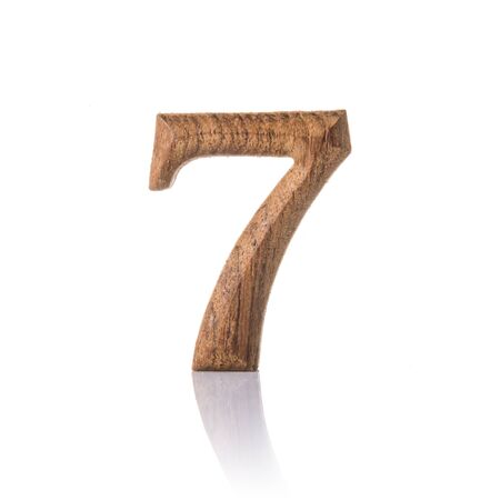 wooden numeric with shadow isolated on white background, number seven,7.の写真素材
