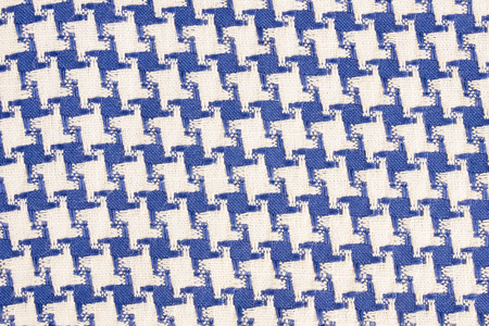 Blue abstract hounds tooth fabric texture background.