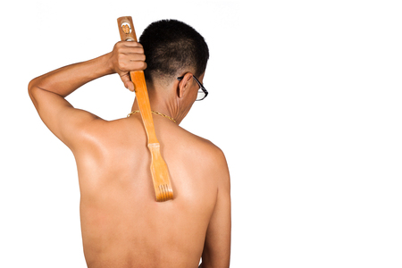 Man body itching by a handle scratchback isolated on white background.の写真素材