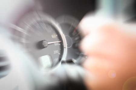 Close up Odometer car in reality high speed with hand holding wheel.