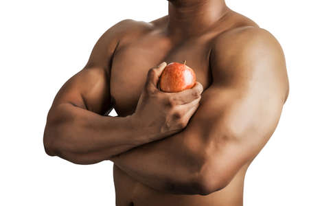 Fit man body with hand holding apple isolated on white background.の写真素材