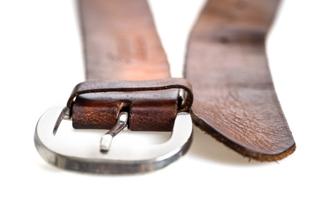 Close up vintage leather belt on white background.
