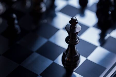 King and Knight of chess setup on dark background . Leader and teamwork concept for success. Chess...