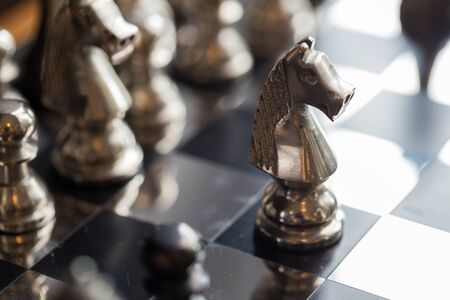 King and Knight of chess setup on dark background . Leader and teamwork concept for success. Chess...