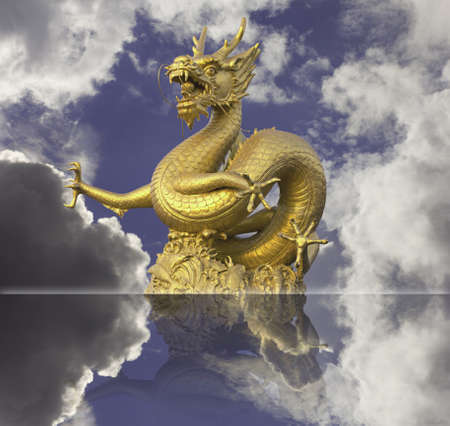 golden chinese dragon statue on blue sky backgroundの写真素材