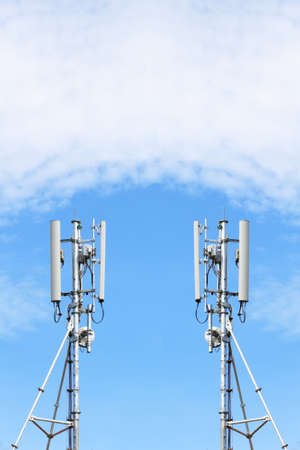 communications tower with antennas against blue skyの写真素材