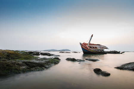 An old fishing boat wreck near the coast.の写真素材