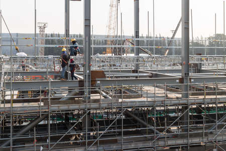 mans install scaffolding on structeralの写真素材